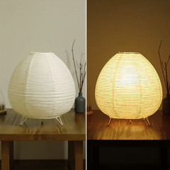 Two views of a round, ribbed table lamp on a wooden surface.